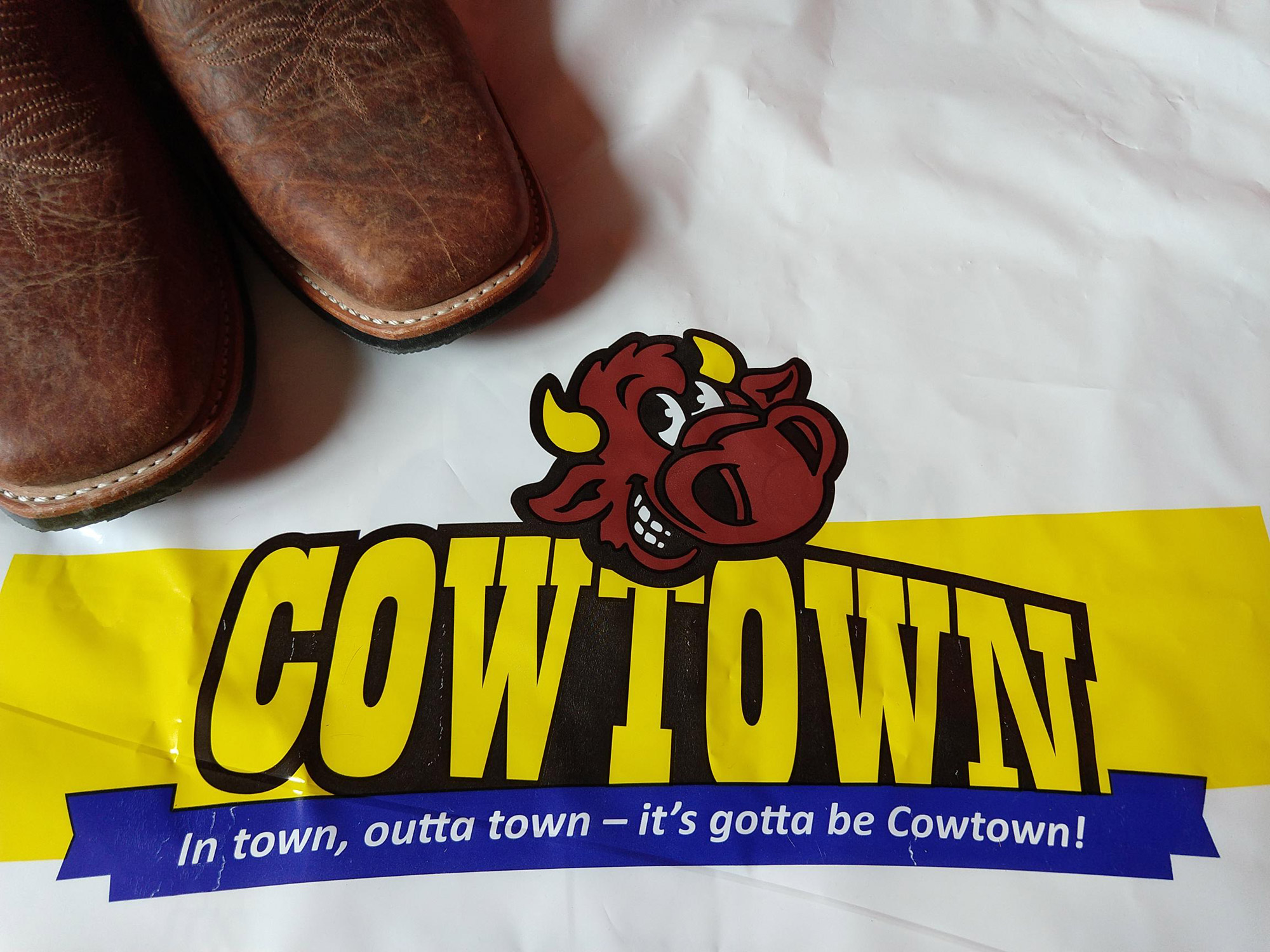 Logo of Cowtown and tips of Cowboy-Boots